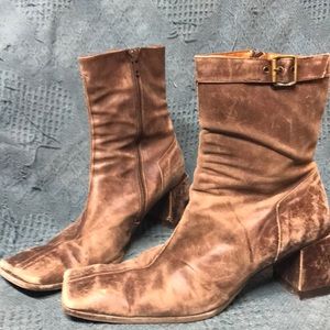 Distressed brown leather boot. Sits slightly above ankle. Size 8.